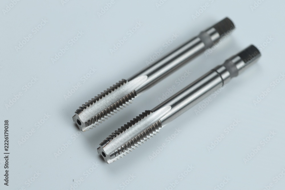 Fototapeta premium a metal-cutting tool designed for cutting or restoring internal threads in pre-drilled holes