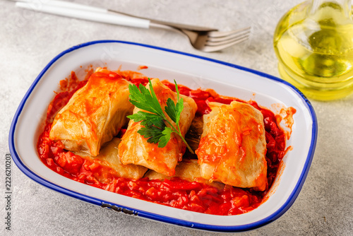 Delicious stuffed cabbage rolls served with tomato sauce