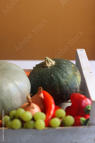 White wooden crate full of seasonal autumnal produce. Selective focus.