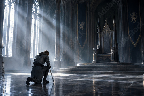 A knight kneels before an empty throne in a grand, sunlit castle hall.