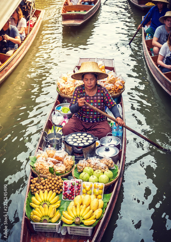 vibrant scene at a traditional floating market in Thailand