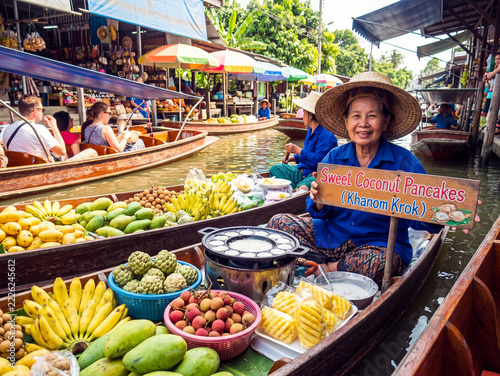 vibrant scene at a traditional floating market in Thailand