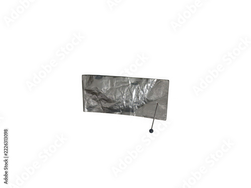 Crumpled aluminum foil with a sewing pin