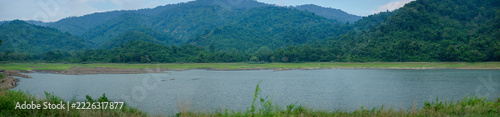 Serene Mountain Landscape with Calm Water and Lush Greenery
