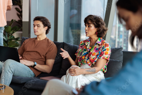 A colleague contributes to the group conversation