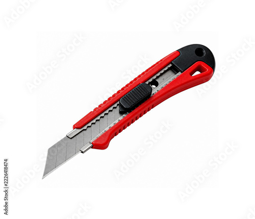 Red utility cutter knife with retractable steel blade isolated on a clean white background
