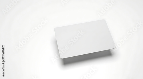 Blank White Plastic Card with Rounded Corners Casting a Shadow on a White Background with Subtle Lighting