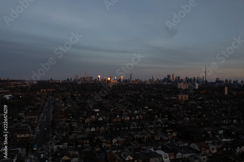 Photography Toronto downtown skyline at sunset with the CN Tower, golden light glinting off