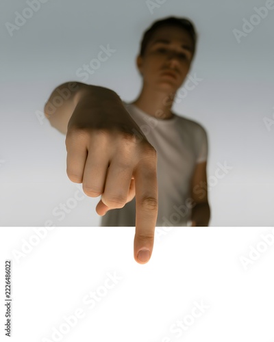 Person pointing with an index finger in an expressive gesture directing attention and indicating a direction for communication and promotional concepts with a bold visual emphasis on the hand movement
