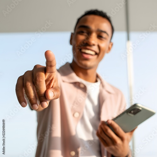 Person pointing with an index finger in an expressive gesture directing attention and indicating a direction for communication and promotional concepts with a bold visual emphasis on the hand movement