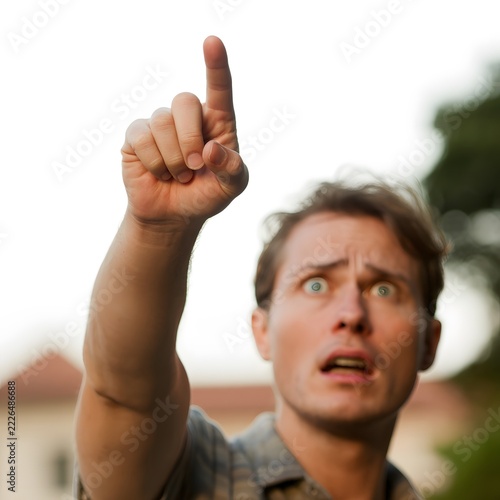 Person pointing with an index finger in an expressive gesture directing attention and indicating a direction for communication and promotional concepts with a bold visual emphasis on the hand movement