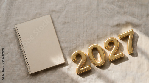 New Year 2027 Elegant Stationery Flat Lay With Handcrafted Cards And Calligraphy On Wooden Background