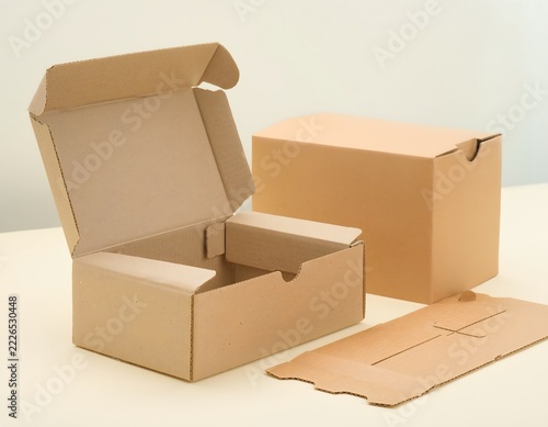 Plain Cardboard Prototype Boxes in Three Different Structural Forms Arranged on a Pale Background, Minimal Packaging Design Mockup