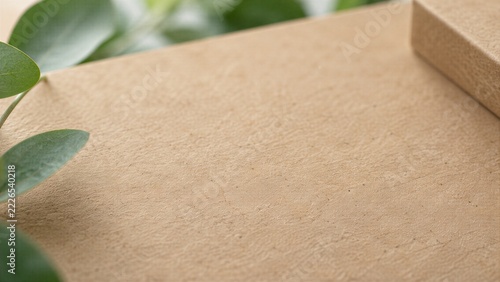 Minimalist kraft paper backdrop with subtle natural grain and smooth texture, offering ample copy space for eco-friendly design and recycled paperboard concepts.