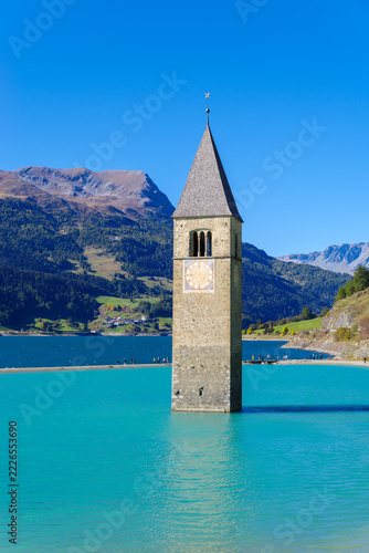 Famous sunken 14th-century church bell tower emerging from Lake Reschen (Reschensee), South Tyrol, Italy