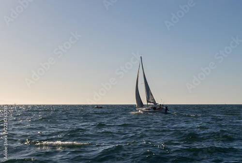 Sailboat Passing Channel Islands Harbor Jetty in Port Hueneme California