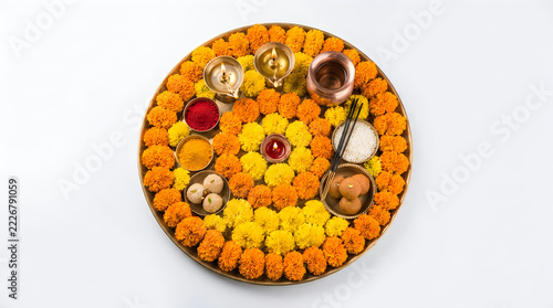 Traditional indian puja thali with flowers fruits and ritual objects for worship