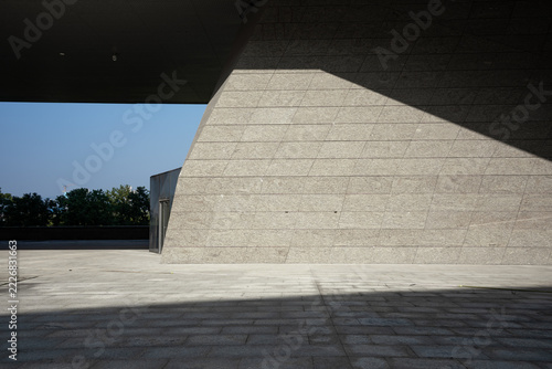 modern architecture grey stone exterior wall and shadow