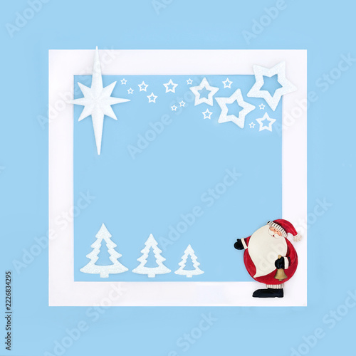 Christmas vintage Santa Claus decoration, north pole concept with star bauble background, white border frame on blue. Festive design for greeting card.