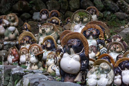 Collection of Traditional Tanuki Pottery Figurines at a Buddhist Temple in Kyoto, Japan