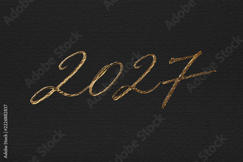 2027 number golden cursive handwritten text on black paper, new year, simple, aesthetic, elegant, luxurious, for greeting card, banner, calendar 