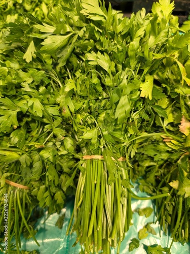 bunches of fresh green parsley on a supermarket
