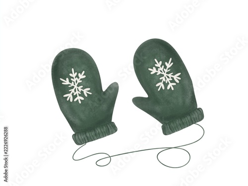 Fotografie Cozy green knitted winter mittens with white snowflake pattern and string