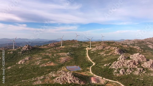 Aerial view of wind turbines on mountain landscape in Sardinia, Italy