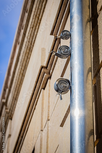 FRANCE-DIJON-METAL-SNAIL-SCULPTURES-ON-DOWNSPOUT