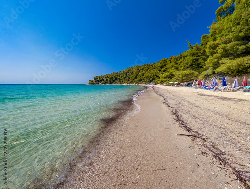 Shoreline of Agios Nikolaos beach with clear water