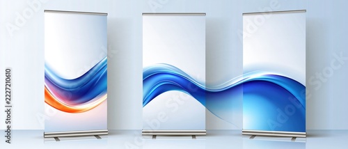 Three elegant roll-up banners stand in a clean, white room