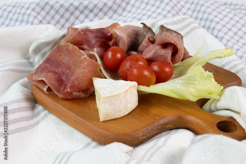 Cold Cut, Parma Ham , Platter with Cured Meats, Camembert, and Cherry Tomatoes