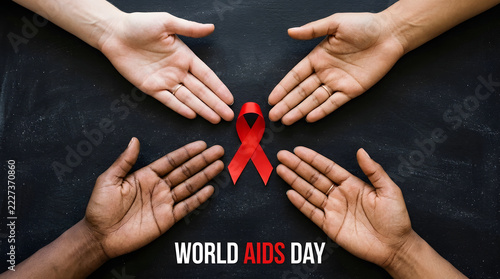 Four diverse hands cradle a red ribbon symbolizing world aids day against a dark chalkboard background aidsawareness aidsday aidsribbon awarenesscampaign