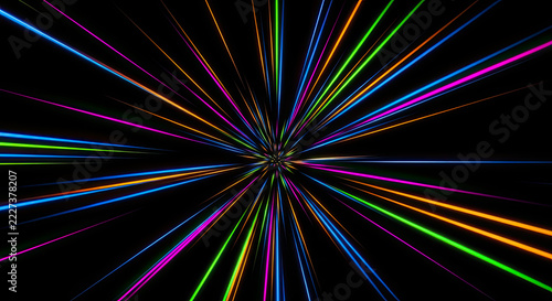 A black background showcases a vibrant burst of multicolored light rays emanating from a central point.
