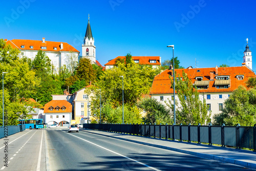 Bridge over Sava river and old town of Kranj, Slovenia – Historic Red Rooftops and cathedral tower
