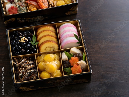 Top down photo of traditional Japanese osechi jubako lacquered box filled with New Year dishes