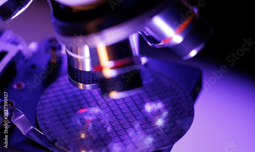 Macro microscope silicon wafer and microchip circuitry for technology background, quality inspection and engineering