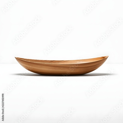 A minimalist product photography of a single elongated wooden bowl, boat-shaped design, made from natural light-brown teak wood with visible fine wood grain texture, smooth polished surface