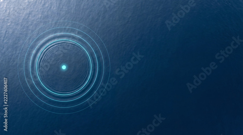 Glowing Cyan Ripple on Calm Deep Blue Ocean Surface, Aerial View