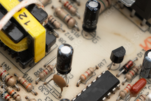 Circuit board with resistors microchips and electronic components background. Computer hardware technology.