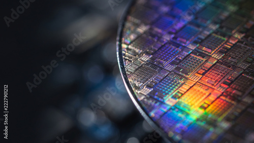 Semiconductor silicon wafer with iridescent rainbow circuit reflections with copy space