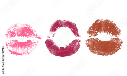 Obraz na plátně Three distinct lipstick kiss marks in shades of pink, dark magenta, and brown is