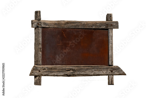 Rustic wooden frame with rusty metal sign isolated on black background
