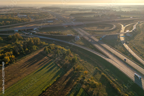 Aerial view of the A1 and A2 motorway interchange near Stryków, Poland, at sunrise
