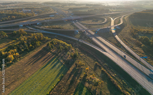 Aerial view of the A1 and A2 motorway interchange near Stryków, Poland, at sunrise