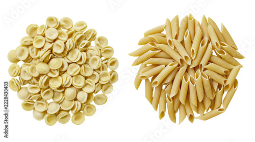 Fotografie Dry orecchiette and penne pasta shapes arranged in two separate piles