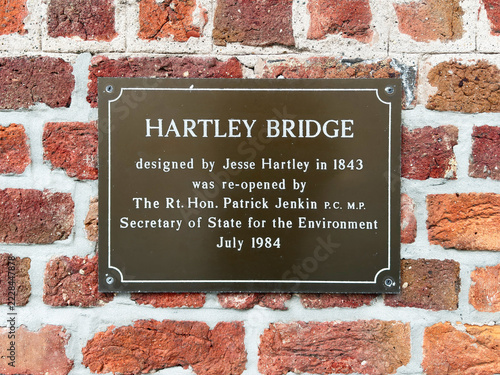 Fotografie Hartley Bridge plaque on historic brick wall in Liverpool, UK commemorating 1843