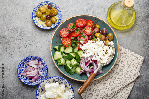 Greek salad with tomatoes, feta cheese, cucumbers, olives, red onion