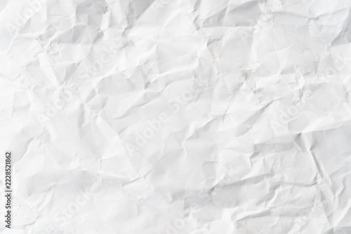 Grunge wrinkled white color paper textured background with copy space. Use for decoration or layer