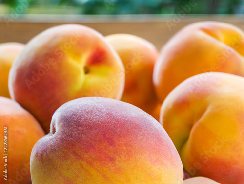 Close-up of ripe peaches with warm tones and natural texture